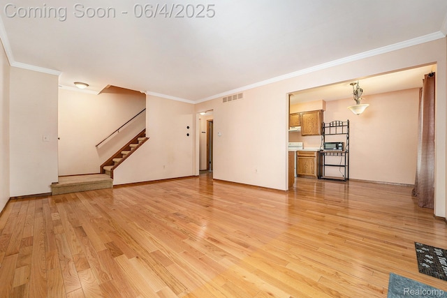 35638 Stillmeadow Ln, Clinton Township, MI 48035 - unfurnished living room with ornamental molding, light wood-type flooring, stairs, and baseboards