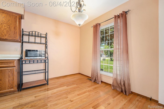 35638 Stillmeadow Ln, Clinton Township, MI 48035 - spare room with plenty of natural light, light wood-style flooring, and baseboards