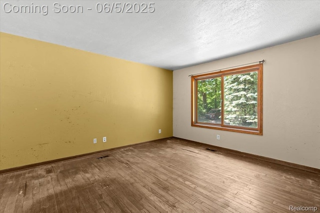 13041 Big Lake Rd, Davisburg, MI 48350 - unfurnished room featuring hardwood / wood-style flooring and baseboards