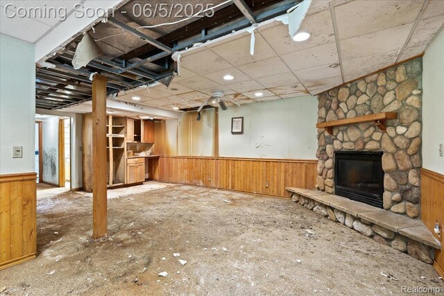 13041 Big Lake Rd, Davisburg, MI 48350 - unfurnished living room with wainscoting and a stone fireplace