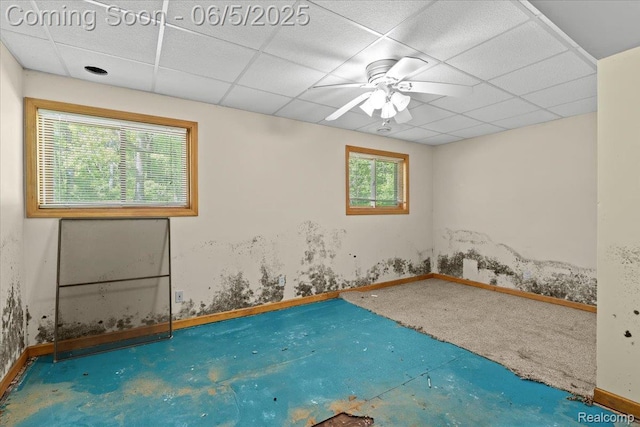 13041 Big Lake Rd, Davisburg, MI 48350 - spare room featuring a paneled ceiling, a ceiling fan, and baseboards