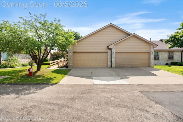 2343 Heritage Pointe Dr Unit 29, Sterling Heights, MI 48314 - mid-century inspired home with a front yard, driveway, brick siding, and a garage