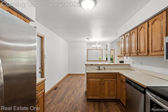 2343 Heritage Pointe Dr Unit 29, Sterling Heights, MI 48314 - kitchen featuring stainless steel appliances, a sink, light countertops, and brown cabinetry