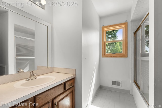 2343 Heritage Pointe Dr Unit 29, Sterling Heights, MI 48314 - full bathroom featuring vanity, baseboards, tile patterned floors, and combined bath / shower with glass door