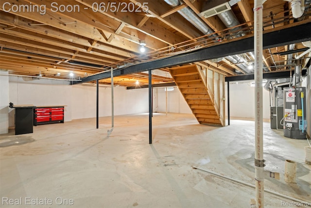 2343 Heritage Pointe Dr Unit 29, Sterling Heights, MI 48314 - unfinished basement featuring gas water heater and stairway