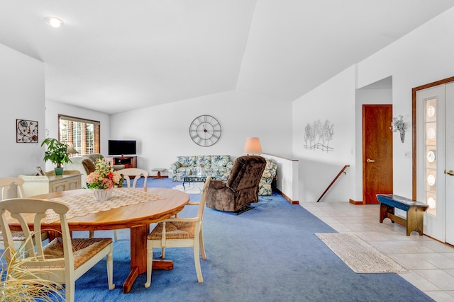 3547 Sand Bar Ct, Muskegon, MI 49441 - dining space featuring light carpet, lofted ceiling, and light tile patterned flooring