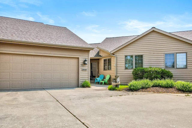 3547 Sand Bar Ct, Muskegon, MI 49441 - view of front of property with roof with shingles and concrete driveway
