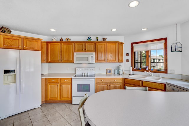 3547 Sand Bar Ct, Muskegon, MI 49441 - kitchen featuring white appliances, a sink, light tile patterned flooring, recessed lighting, and light countertops