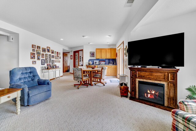 3547 Sand Bar Ct, Muskegon, MI 49441 - living room with light colored carpet, recessed lighting, and a glass covered fireplace
