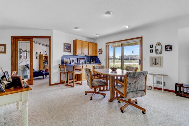 3547 Sand Bar Ct, Muskegon, MI 49441 - dining area featuring light colored carpet and baseboards