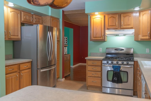 18735 Jefferson Rd, Morley, MI 49336 - kitchen featuring appliances with stainless steel finishes, under cabinet range hood, light countertops, brown cabinets, and wooden ceiling