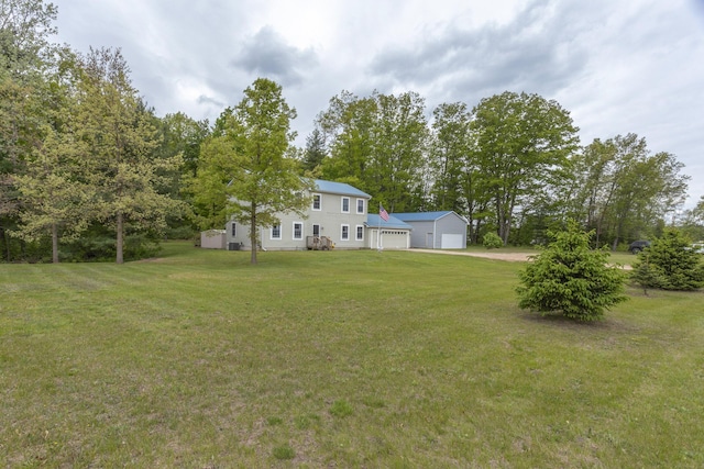 18735 Jefferson Rd, Morley, MI 49336 - view of grassy yard with a detached garage