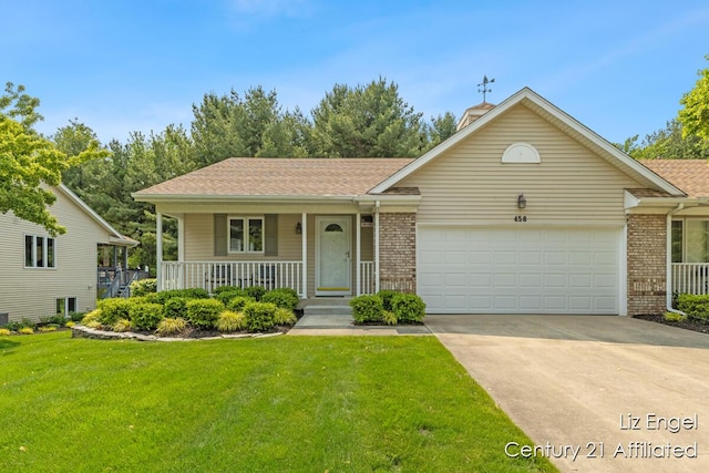 458 Amity St, Douglas, MI 49406 - view of front facade featuring covered porch, a garage, driveway, and brick siding