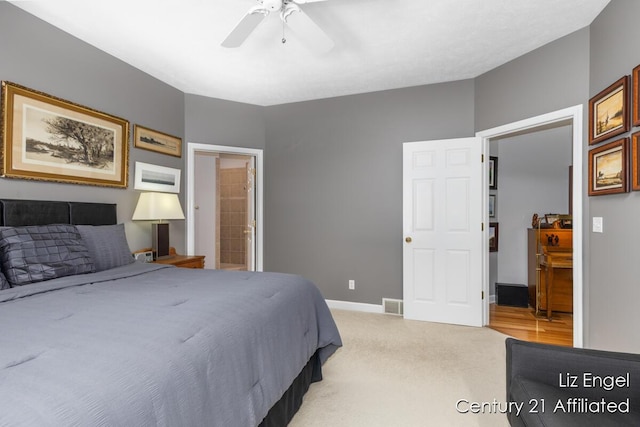 458 Amity St, Douglas, MI 49406 - bedroom with ceiling fan, light colored carpet, baseboards, and ensuite bathroom