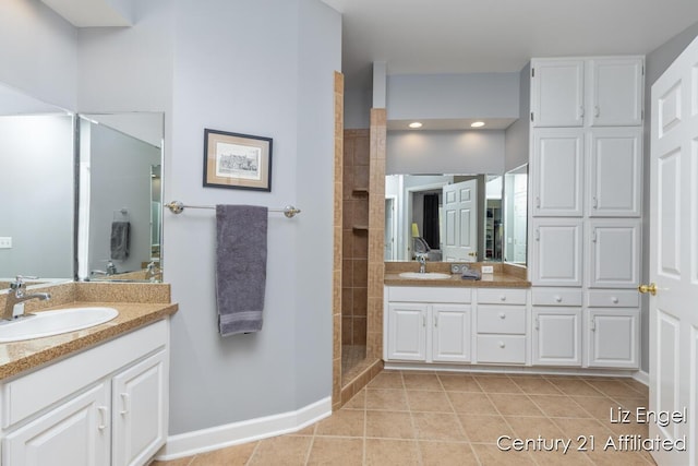 458 Amity St, Douglas, MI 49406 - bathroom with vanity, tile patterned floors, a tile shower, and baseboards