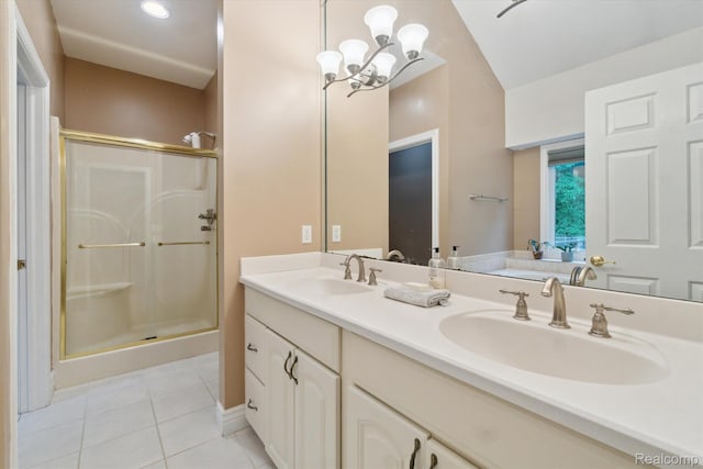 8883 Dixie Hwy, Birch Run, MI 48415 - full bathroom featuring tile patterned flooring, a shower stall, double vanity, a chandelier, and vaulted ceiling