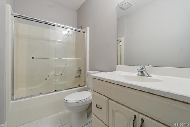 8883 Dixie Hwy, Birch Run, MI 48415 - bathroom featuring tile patterned flooring, vanity, and combined bath / shower with glass door