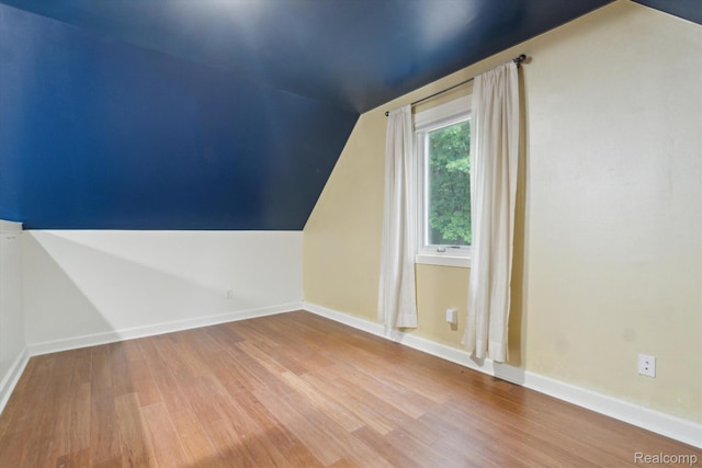 8883 Dixie Hwy, Birch Run, MI 48415 - bonus room featuring vaulted ceiling and wood finished floors