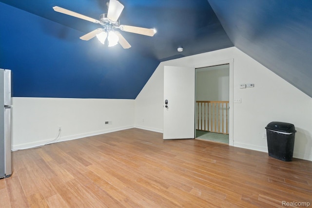 8883 Dixie Hwy, Birch Run, MI 48415 - additional living space featuring a ceiling fan, wood finished floors, and lofted ceiling