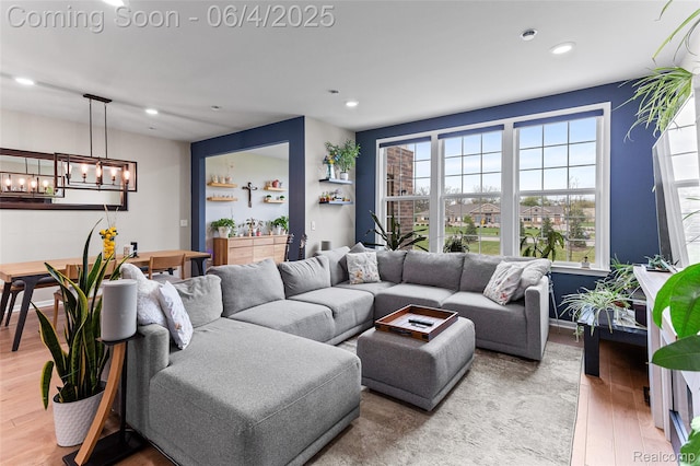 1675 Addison Cir, Walled Lake, MI 48390 - living room featuring a chandelier, wood finished floors, and recessed lighting