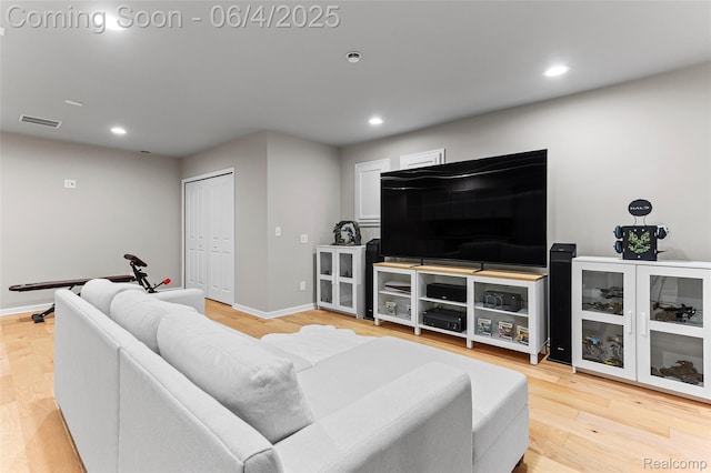 1675 Addison Cir, Walled Lake, MI 48390 - living area with recessed lighting, baseboards, and light wood-type flooring