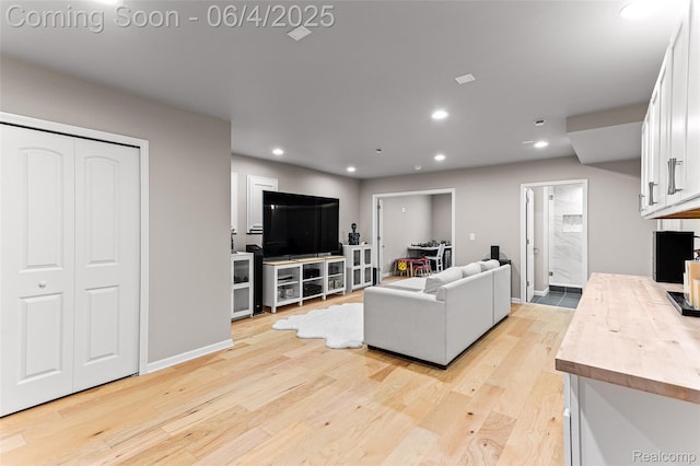 1675 Addison Cir, Walled Lake, MI 48390 - living room with light wood-type flooring, recessed lighting, and baseboards