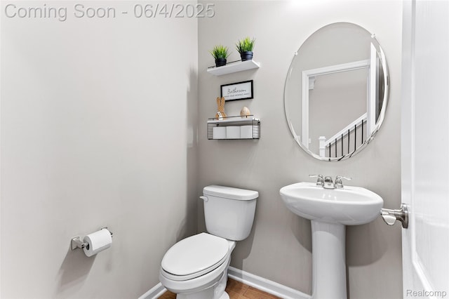 1675 Addison Cir, Walled Lake, MI 48390 - bathroom featuring toilet, baseboards, and a sink