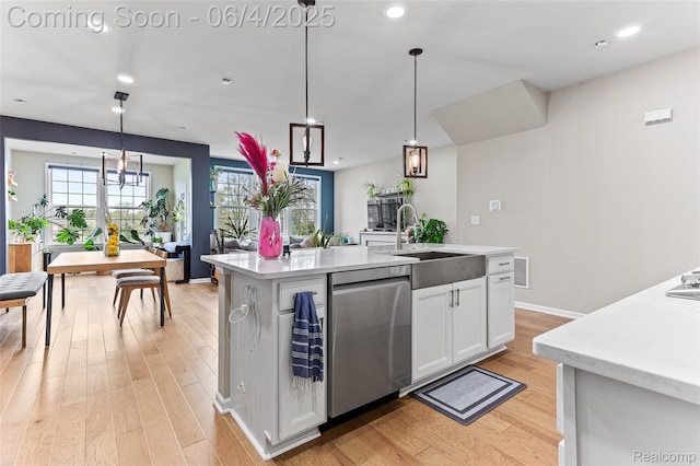 1675 Addison Cir, Walled Lake, MI 48390 - kitchen with stainless steel dishwasher, a sink, light wood-type flooring, light countertops, and white cabinetry