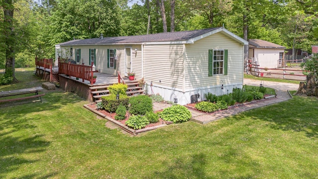 8836 Ora Lake Rd, Hale, MI 48739 - view of front facade with a wooden deck and view of scattered trees