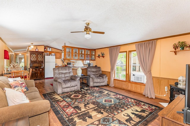 8836 Ora Lake Rd, Hale, MI 48739 - living area with a ceiling fan, ornamental molding, wainscoting, cooling unit, and wood finished floors