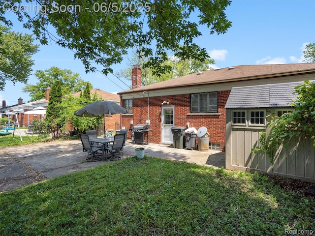 29213 Joan St, Saint Clair Shores, MI 48081 - back of property featuring brick siding, a chimney, and a patio
