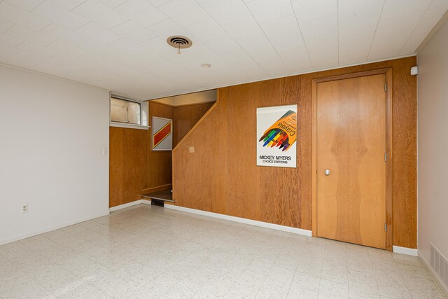1060 Chestnut St, Ann Arbor, MI 48104 - basement with wooden walls and tile patterned floors