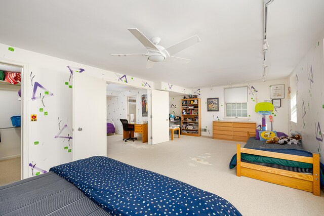 1060 Chestnut St, Ann Arbor, MI 48104 - carpeted bedroom featuring a desk, track lighting, and ceiling fan