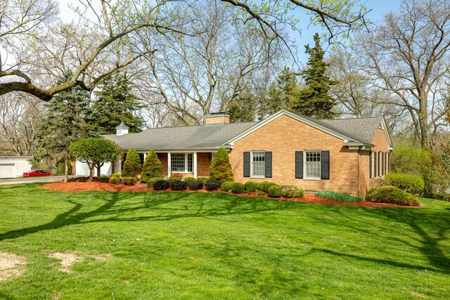 1060 Chestnut St, Ann Arbor, MI 48104 - view of front of home featuring brick siding, a chimney, a front yard, and roof with shingles