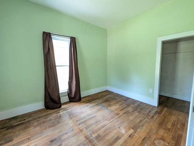 112 Howard St, Gobles, MI 49055 - unfurnished bedroom with wood finished floors and baseboards
