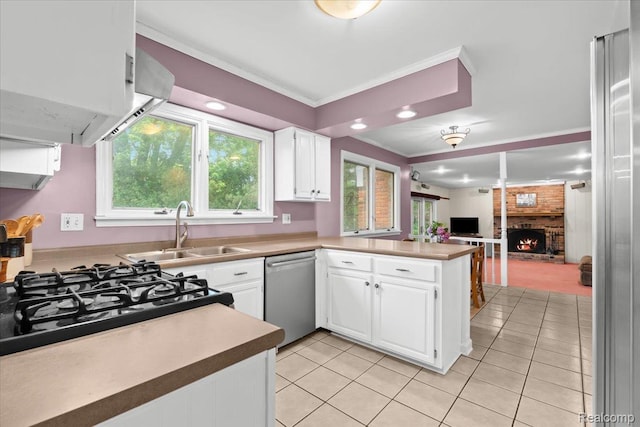 7672 Admiralty Dr, Canton, MI 48187 - kitchen featuring dishwasher, a sink, light tile patterned floors, a peninsula, and a fireplace