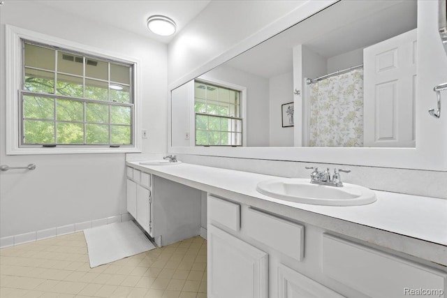 7672 Admiralty Dr, Canton, MI 48187 - bathroom with double vanity, plenty of natural light, and tile patterned floors