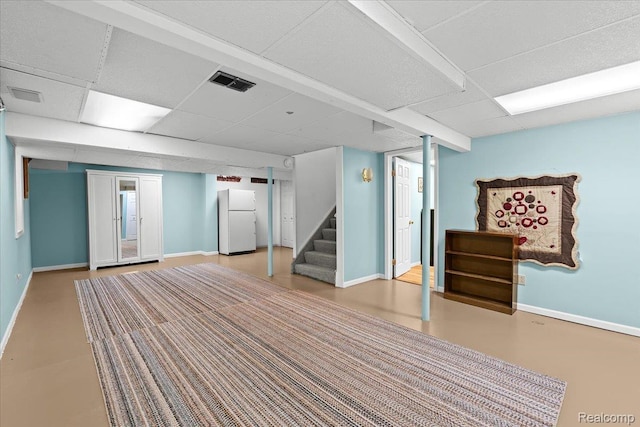 7672 Admiralty Dr, Canton, MI 48187 - finished below grade area with freestanding refrigerator, baseboards, a paneled ceiling, and stairway