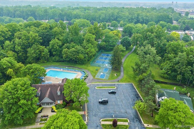 7672 Admiralty Dr, Canton, MI 48187 - drone / aerial view of a pool and a forest