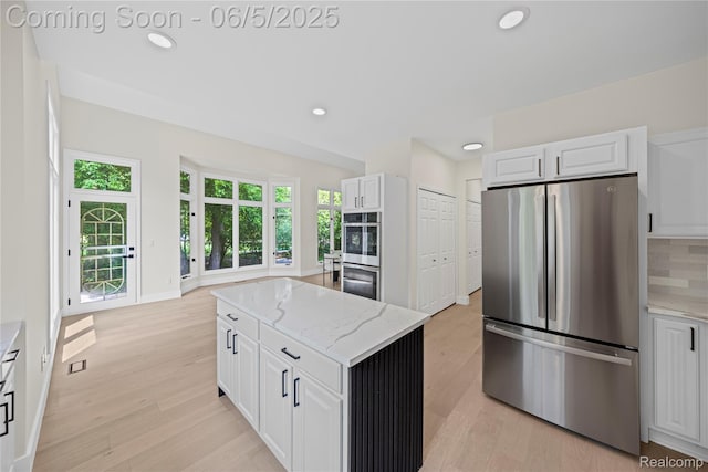 4610 Woodbine Cir W, Bloomfield, MI 48323 - kitchen featuring appliances with stainless steel finishes, recessed lighting, light wood-type flooring, and white cabinetry
