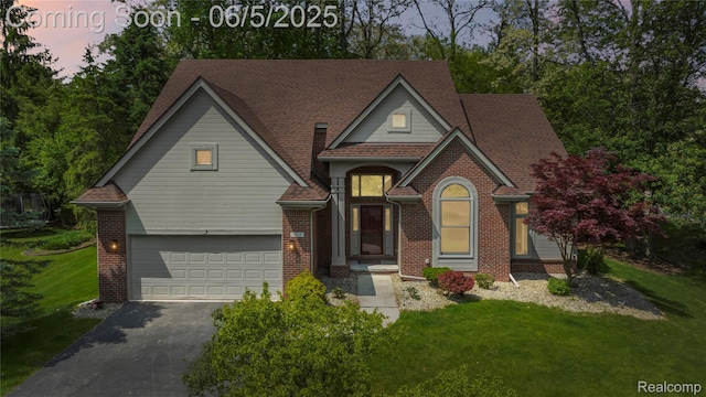 4610 Woodbine Cir W, Bloomfield, MI 48323 - view of front facade featuring driveway, a front lawn, and brick siding
