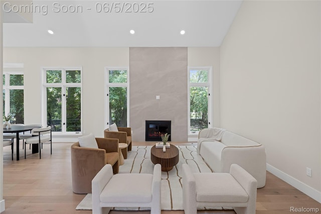 4610 Woodbine Cir W, Bloomfield, MI 48323 - living room featuring recessed lighting, light wood-style floors, a fireplace, and baseboards