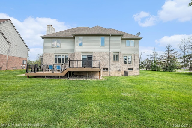6011 Maple Frst, West Bloomfield, MI 48322 - back of property with a wooden deck, a chimney, brick siding, and a lawn