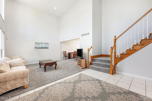 6011 Maple Frst, West Bloomfield, MI 48322 - tiled living area with a towering ceiling, baseboards, stairway, carpet floors, and recessed lighting