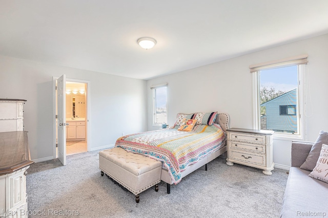 6011 Maple Frst, West Bloomfield, MI 48322 - bedroom with carpet floors, multiple windows, baseboards, and connected bathroom