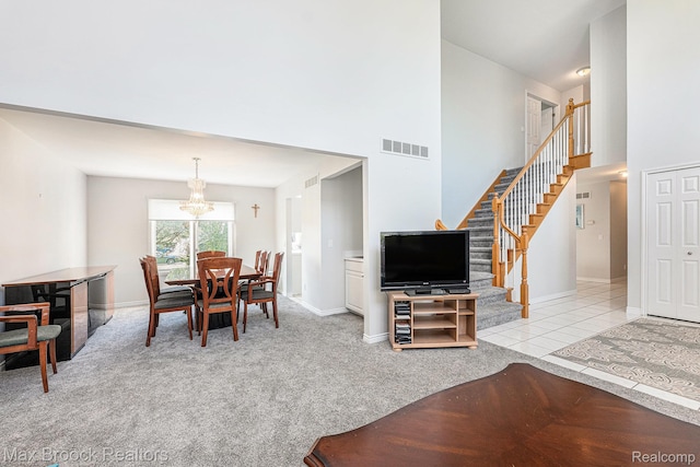 6011 Maple Frst, West Bloomfield, MI 48322 - carpeted dining space featuring stairs, a chandelier, a towering ceiling, and baseboards
