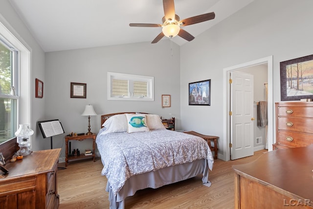 8400 Horton Beach Dr, Manitou Beach, MI 49253 - bedroom featuring lofted ceiling, light wood-type flooring, and a ceiling fan