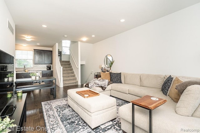4661 Bradley Cir, Troy, MI 48085 - living room with stairway, dark wood finished floors, recessed lighting, and baseboards