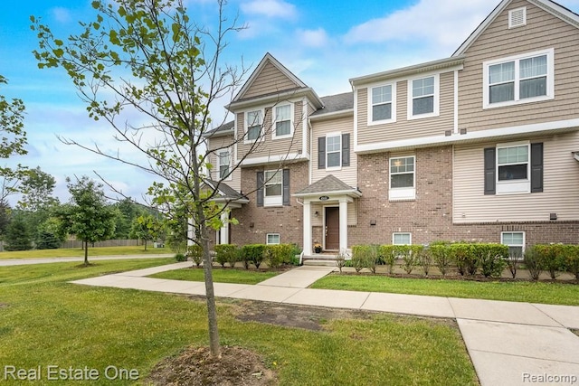 4661 Bradley Cir, Troy, MI 48085 - view of property featuring a front lawn and brick siding