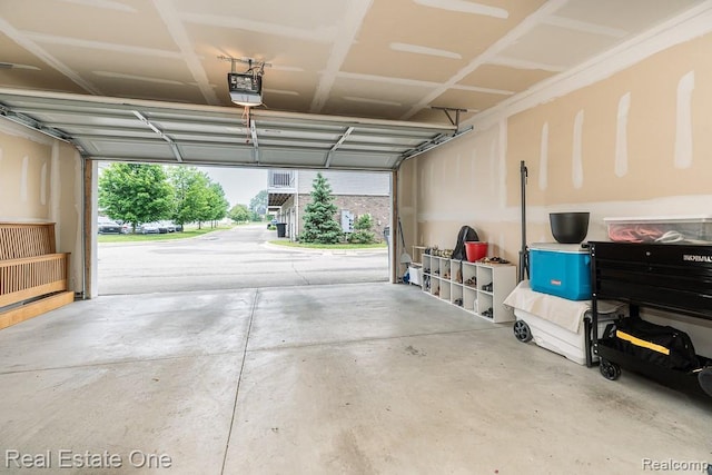 4661 Bradley Cir, Troy, MI 48085 - garage featuring a garage door opener